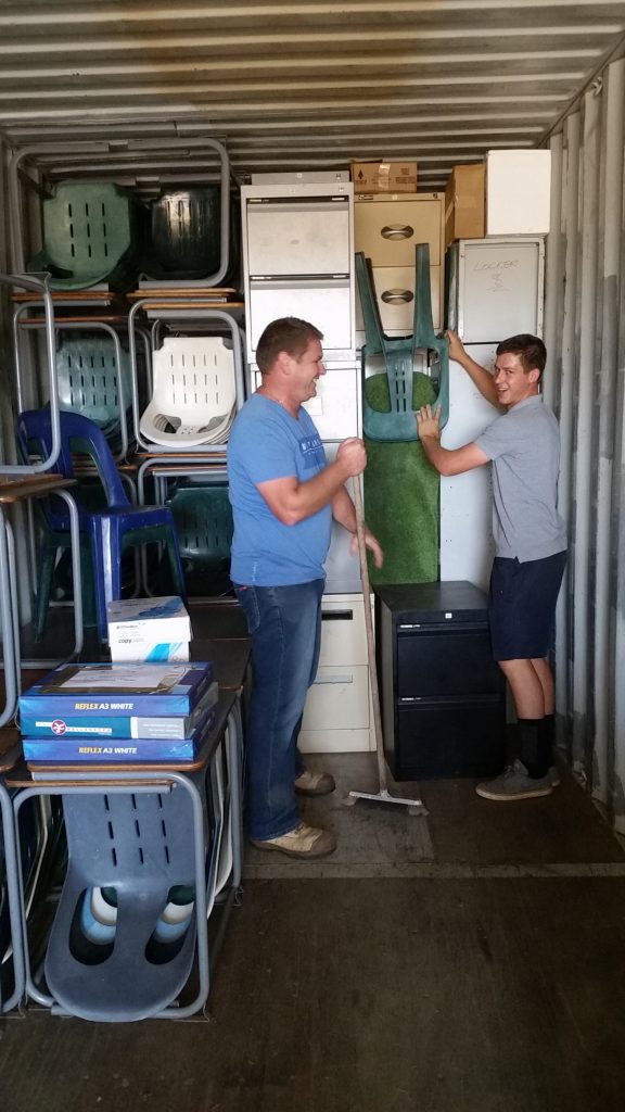 Ex Goodwill students now adults help to collect & pack more for children today