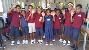 Happy Grade 1 students with brand new shoes. Thank you to all those who so generously provided for these wonderful but needy children.