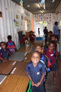 Donated desks and chairs in a donated container classroom. Thanks to all involved. 